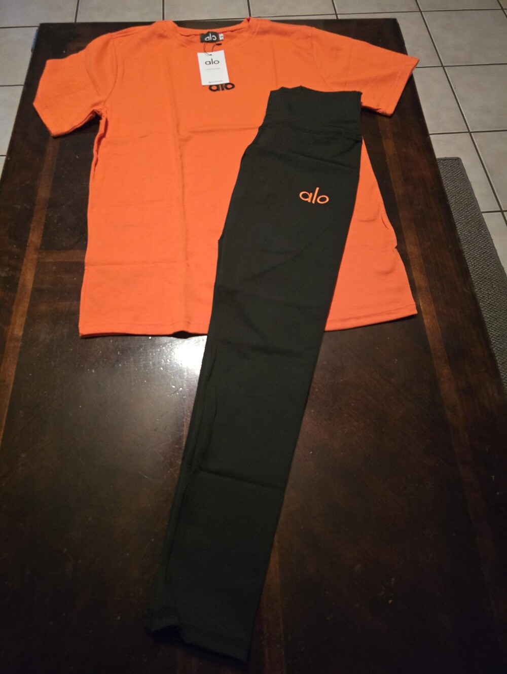 ALO Yoga Black Leggings with Orange Logo